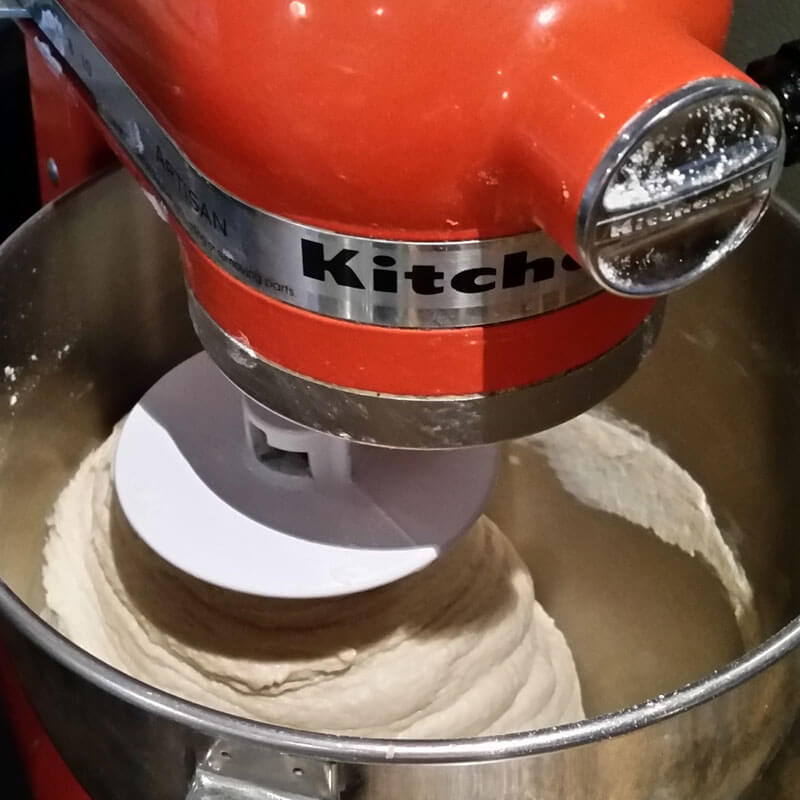 Homemade sourdough bread dough mixing in the kitchen aid mixer