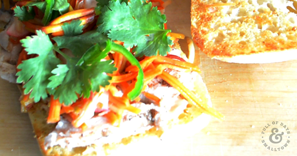 Chicken Banh Mi with pickled radish and carrot salad, cilantro and sliced jalapenos.