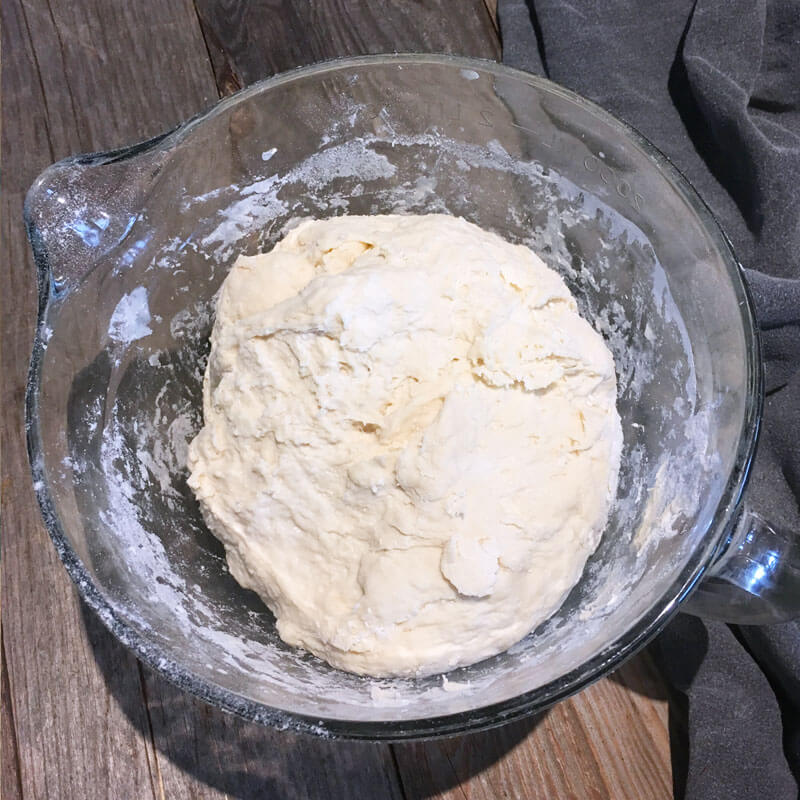 Once starter, flour and water are combined you'll have a shaggy dough. Let it sit, covered for 30 minutes (or up to 4 hours) for the autolyse stage.