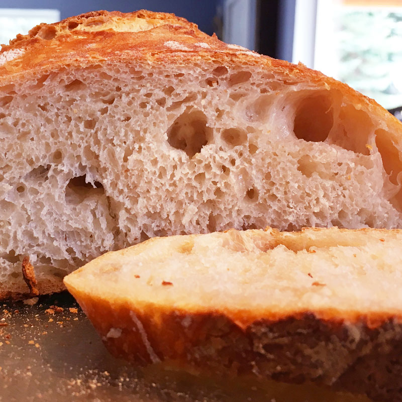 Once cooled, slice into that bread and see the rewards from all your effort! Look at that crumb!