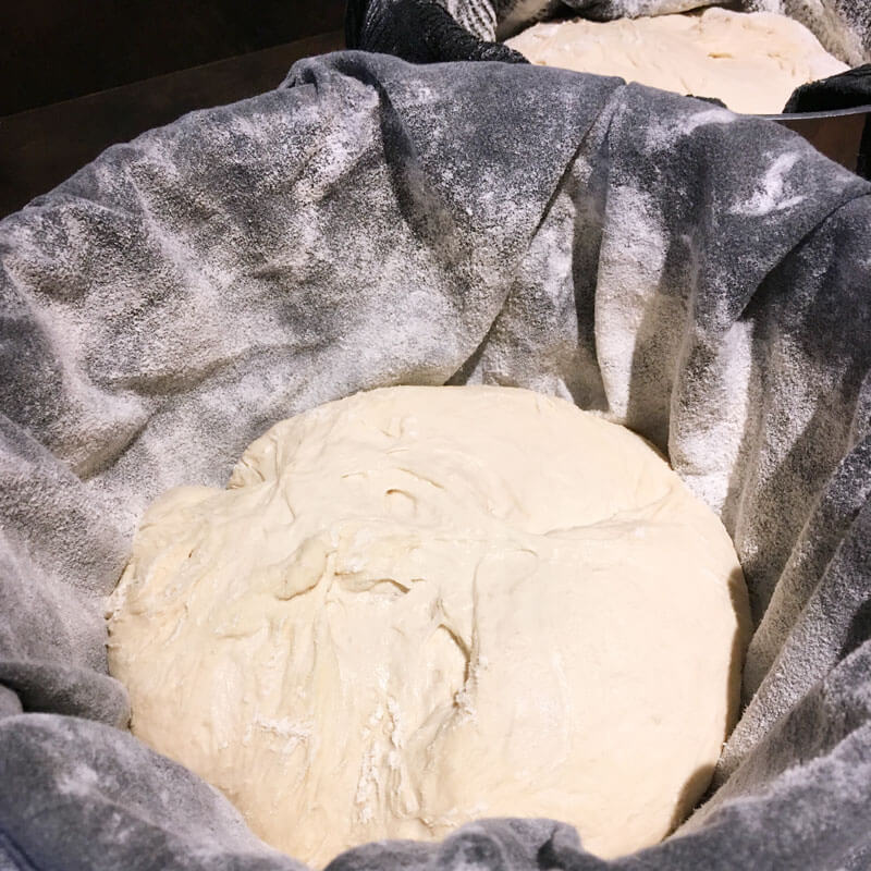 Transfer dough to the prepared proofing baskets/bowls with seam side facing up.