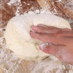 Gently press dough into the center, being careful not to deflate the dough.