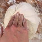 Gently press down in the center of the dough, being careful not to deflate your dough.