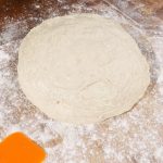Carefully pour out your dough onto a prepared work surface dusted well with flour. Work carefully so you don't deflate the dough.