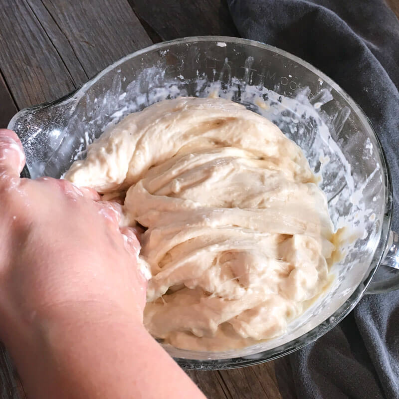 Then fold the dough down to the opposite side. Do this at 3, 6, 9 and 12 o'clock.