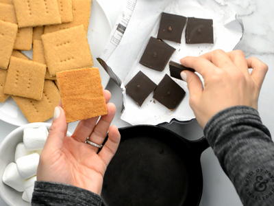 Layering the perfect s'more first starts with a golden brown homemade graham cracker.